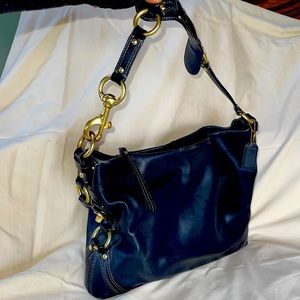 Large Coach shoulder bag with gold hardware. GREAT condition. Badass chic.